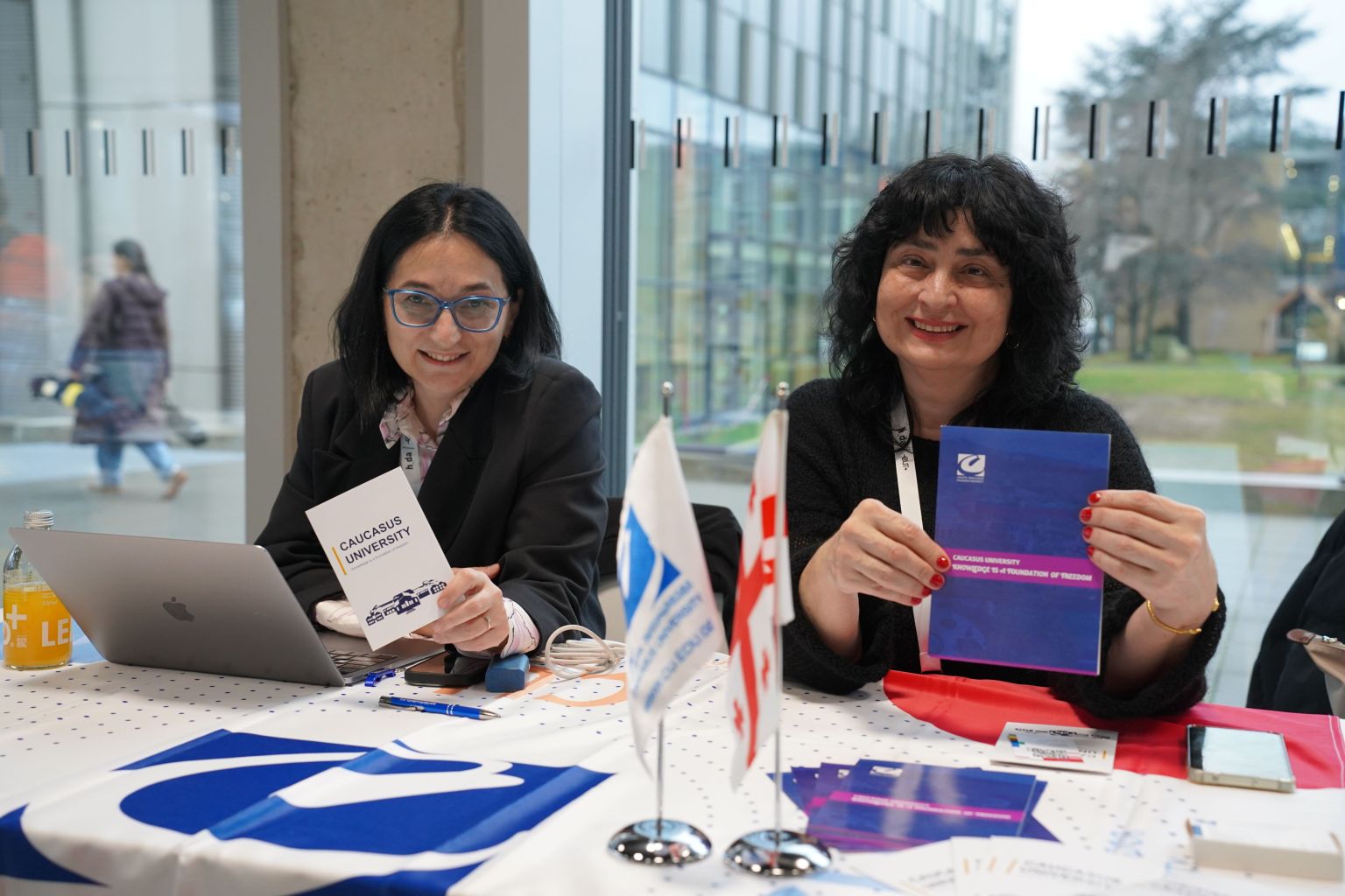 Two people with information material