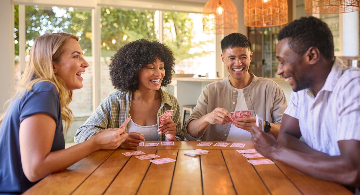 young people playing cards