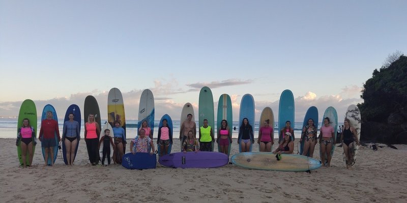 Several people with surfboards in Australia